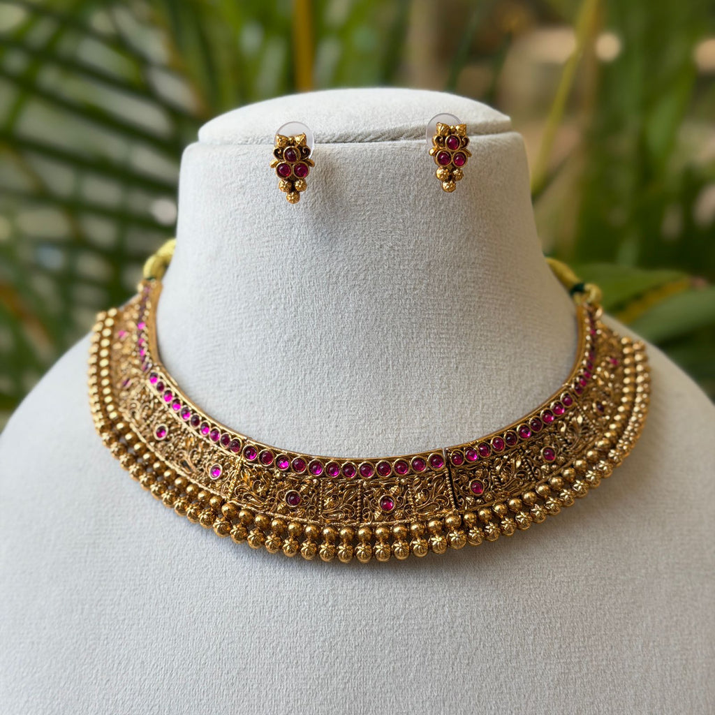 Antique Gold Finish Ruby Choker Necklace Set with Intricate Carving & Gold Bead Drops AN285