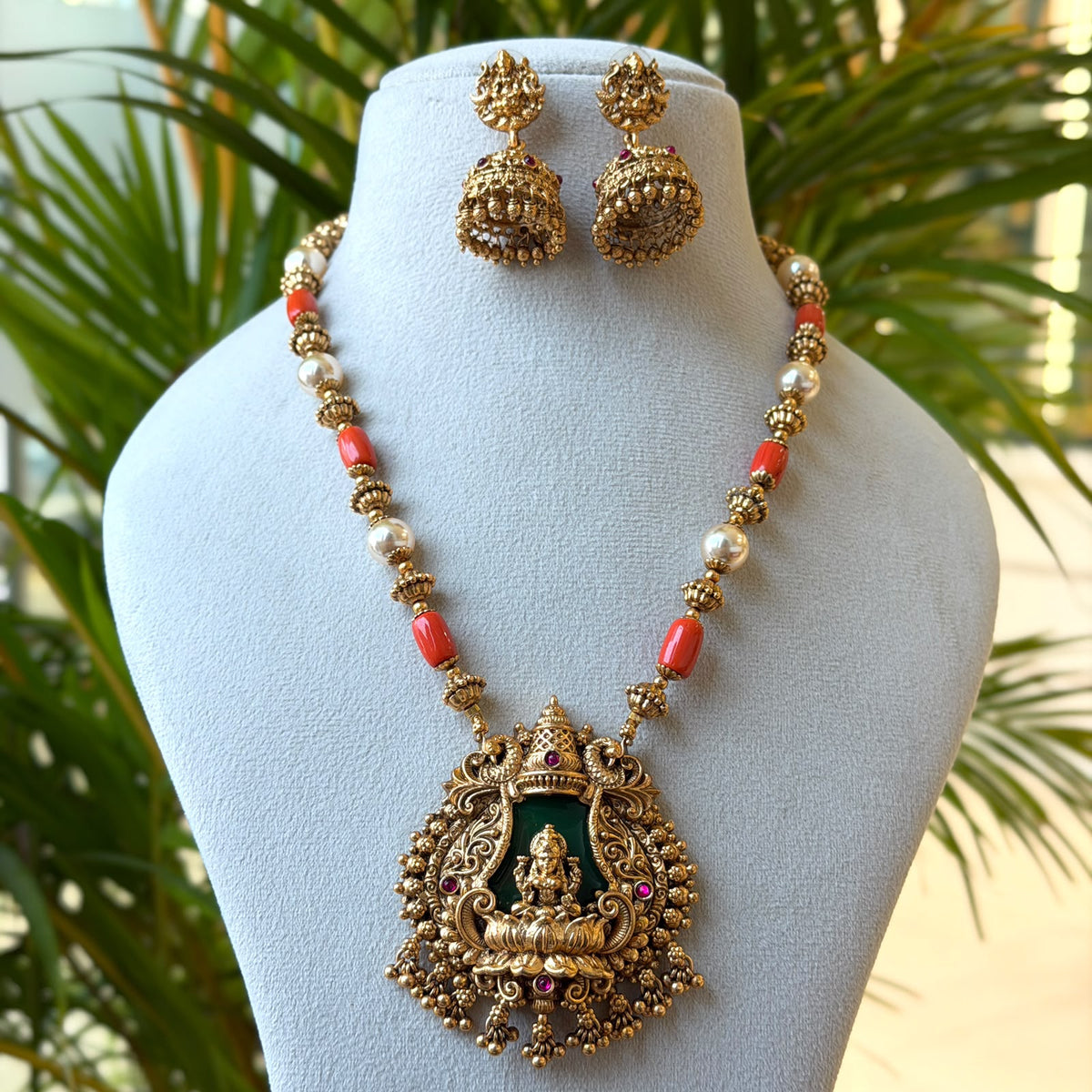 Antique Gold Lakshmi Temple Pendant Set – Coral & Pearl Bead Chain with Green Stone Goddess Pendant & Jhumka Earrings AN480